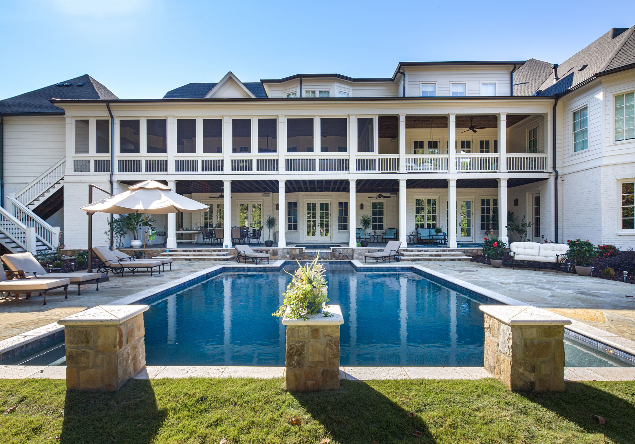 Mansion back porch with pool